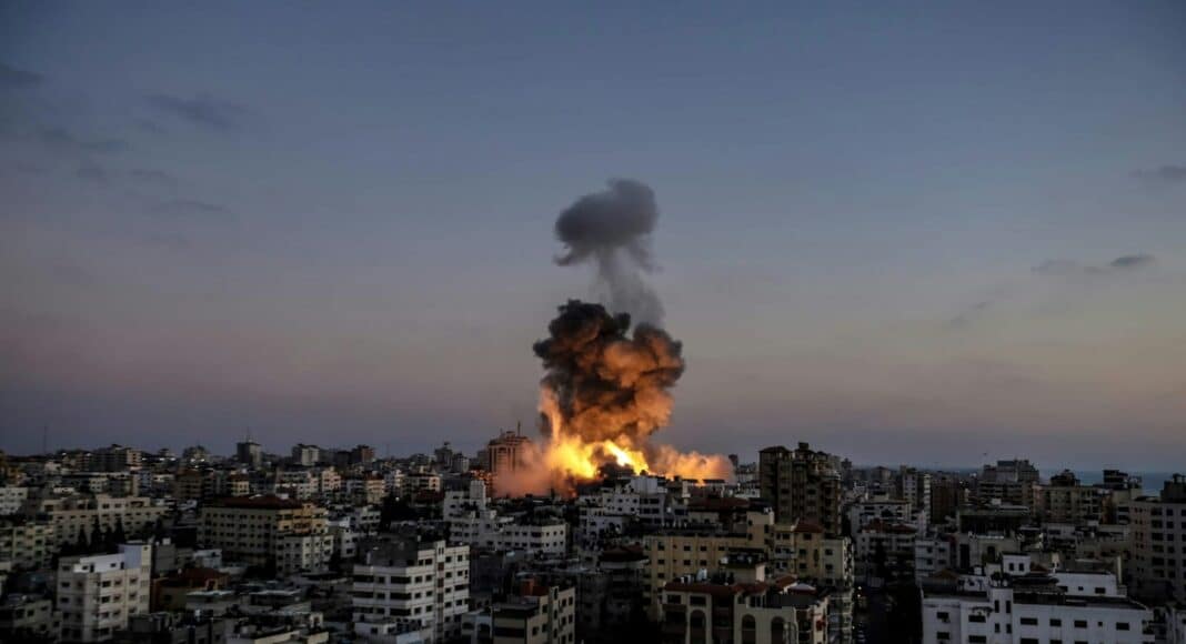 A large fire is burning in a city