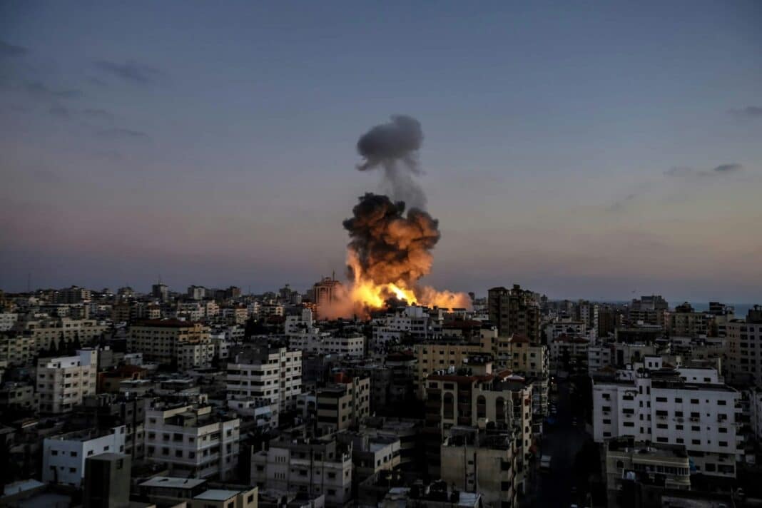 A large fire is burning in a city
