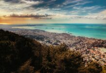aerial photography of mountain and sea during daytime