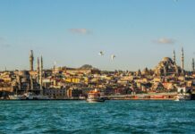 city buildings near body of water during daytime