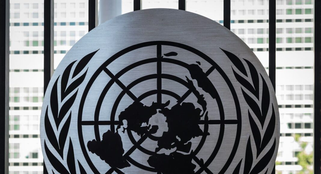 the united nations emblem is on display in front of a window