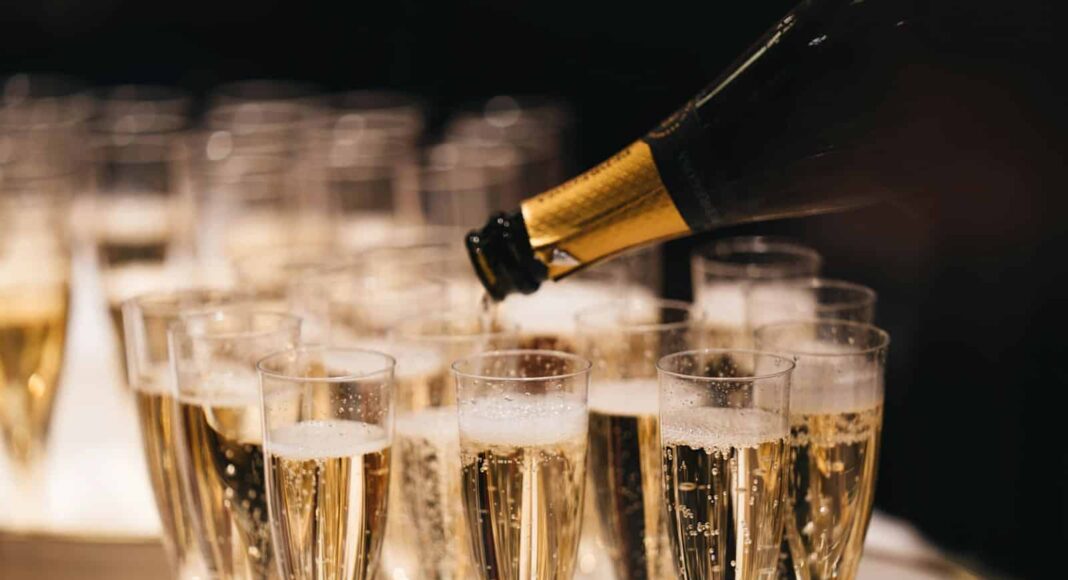 clear drinking glass with brown liquid