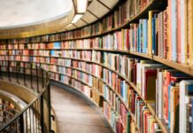 books on brown wooden shelf