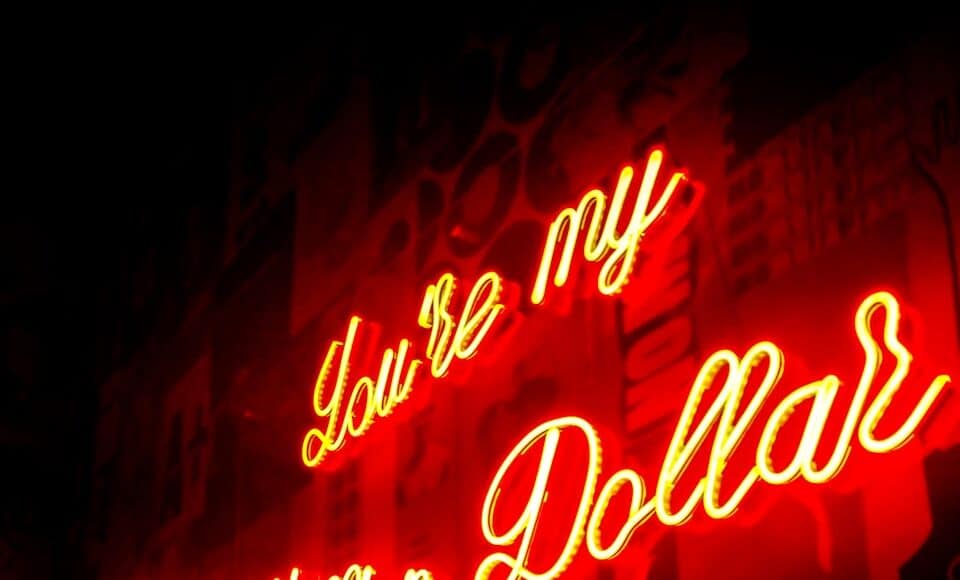 man standing near the LED signage