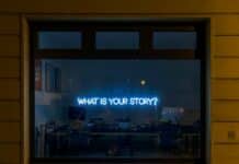 black flat screen tv turned on at the living room