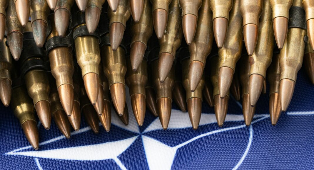 a bunch of bullet like objects on a blue background