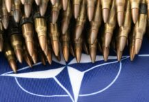 a bunch of bullet like objects on a blue background