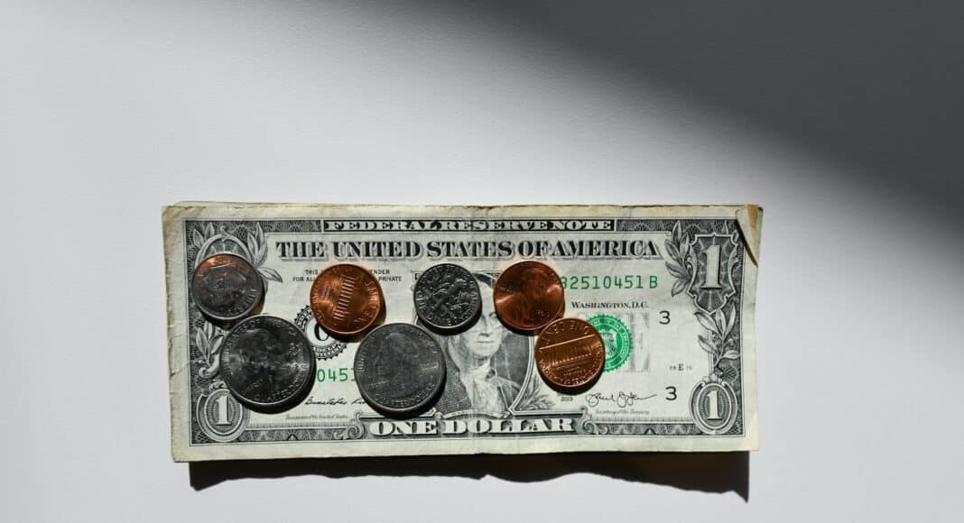 silver and gold round coins in box