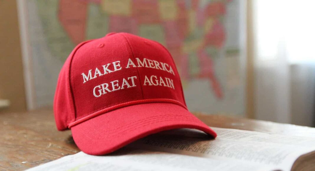 a red hat that reads make america great again