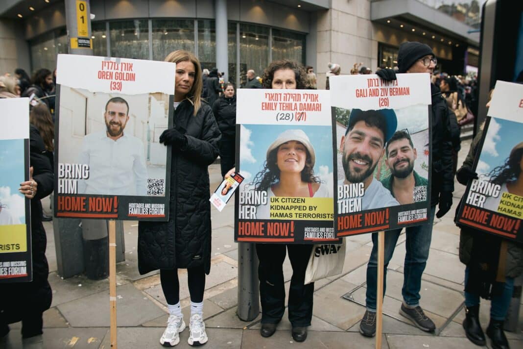 A group of people holding up signs on the street