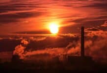 tall building under orange clouds at daytime