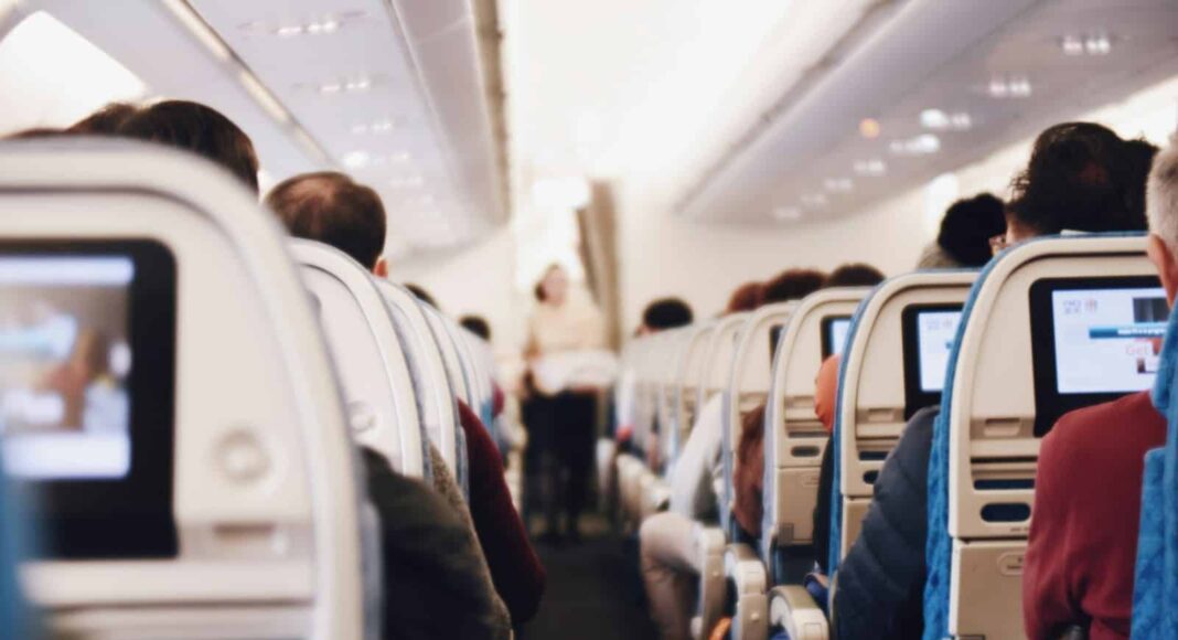 shallow focus photography of people inside of passenger plane