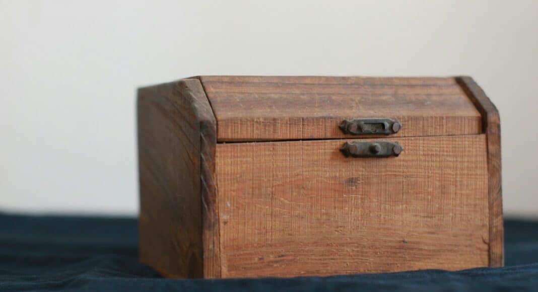 brown wooden chest box on black table