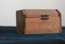 brown wooden chest box on black table
