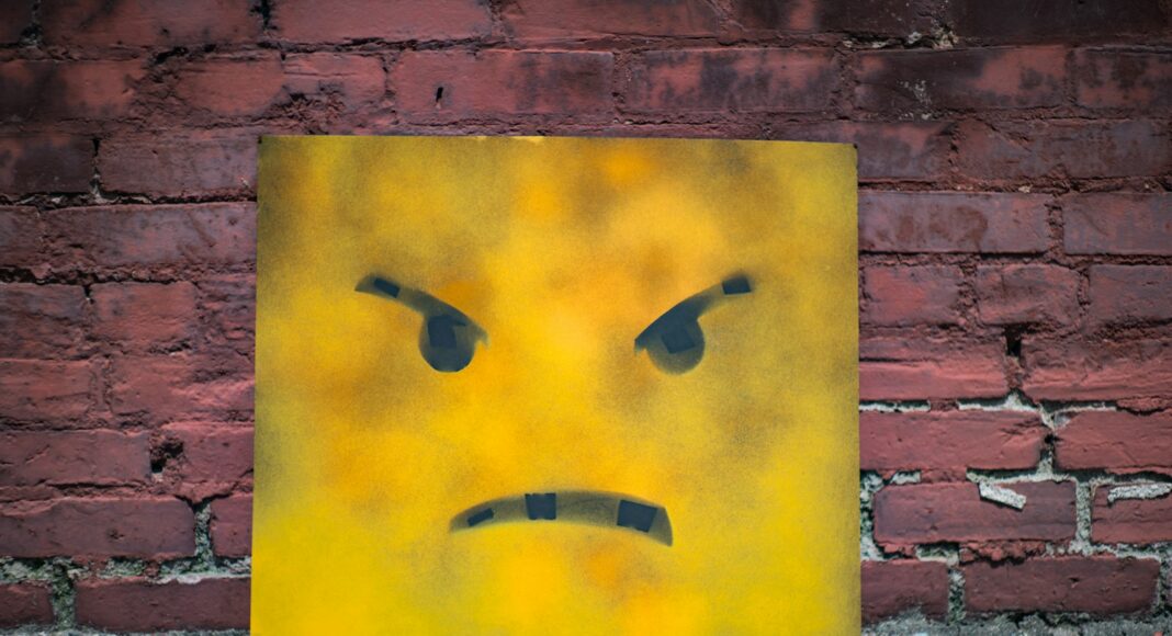 yellow and black smiley wall art