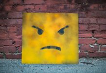 yellow and black smiley wall art