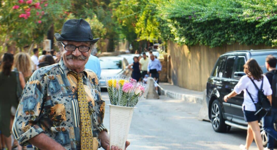 man holding flowers during daytime