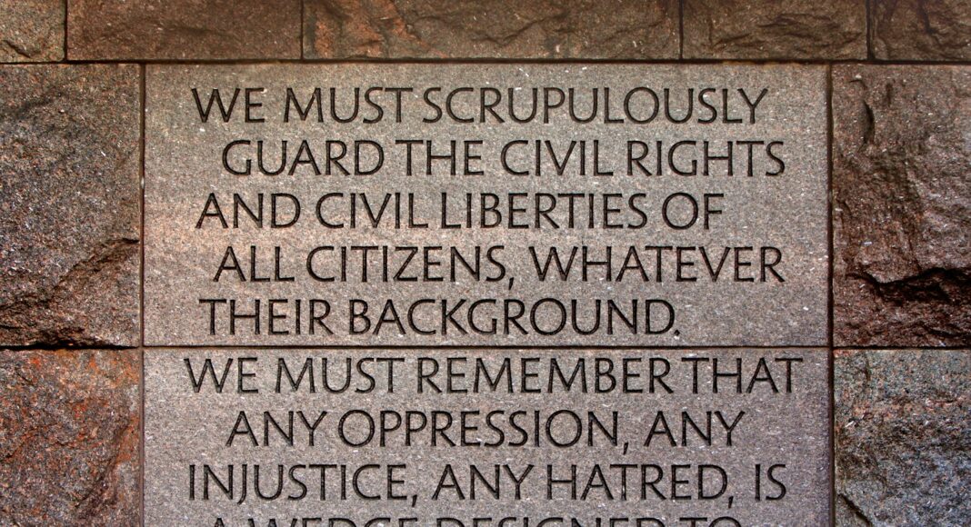 A stone wall with a plaque on it