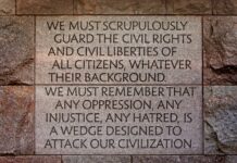 A stone wall with a plaque on it