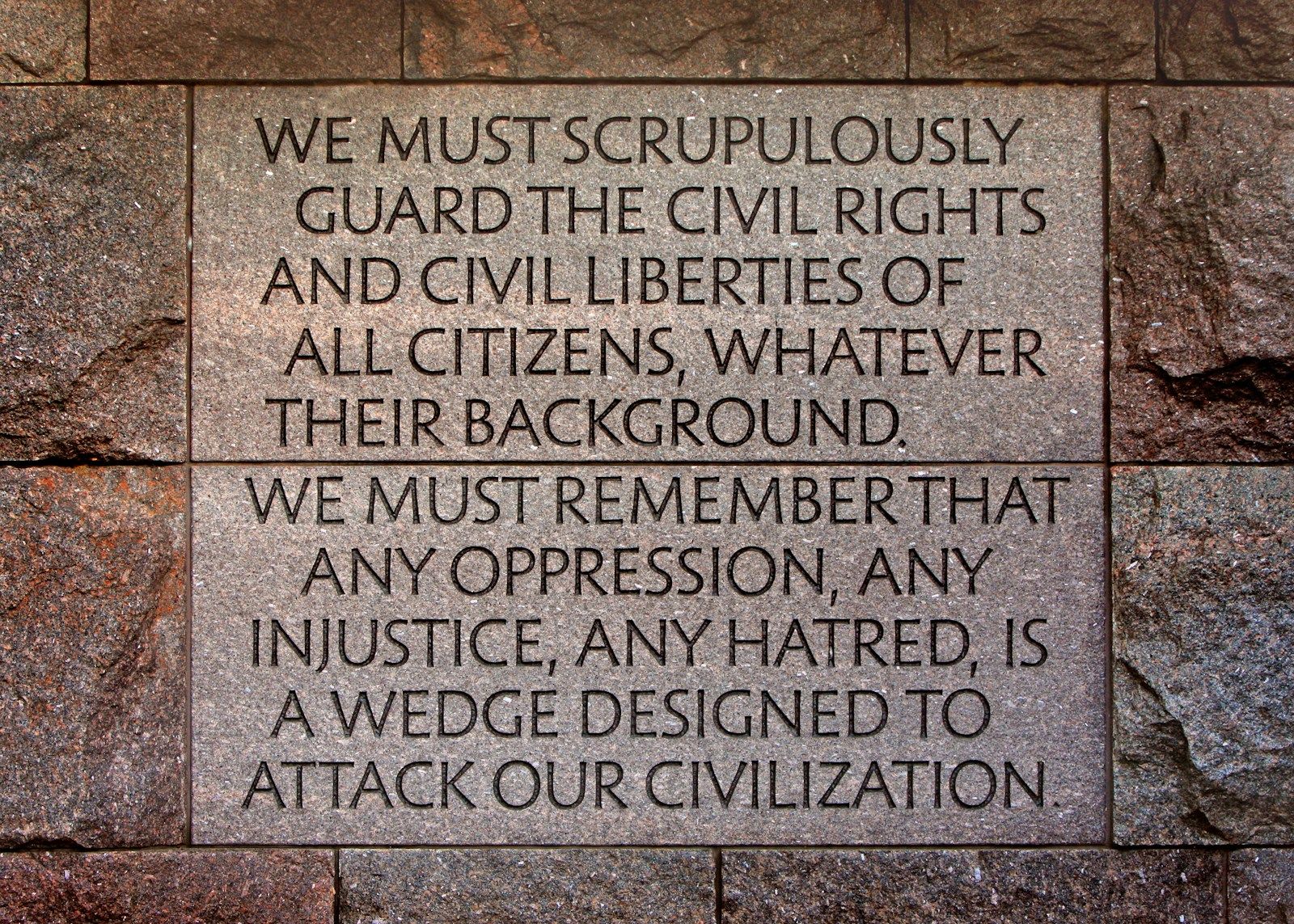A stone wall with a plaque on it