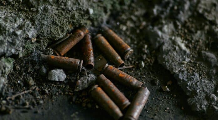 brown cigarette butts on black surface